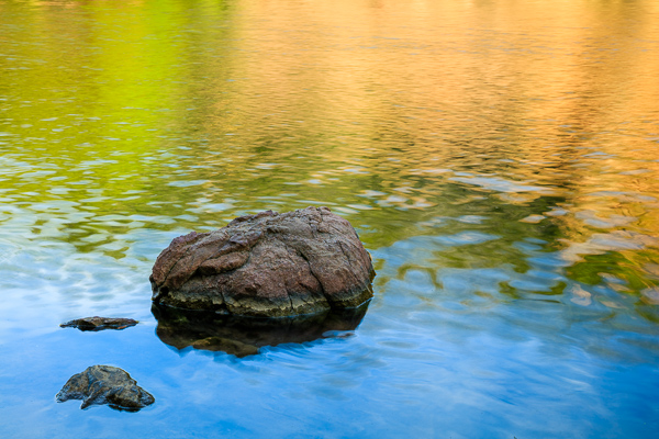 Blue;Boulder;Boulders;Brown;Calm;Flow;Gold;Healing;Health care;Healthcare;Minimalism;Nature;Pastoral;Ripple;River;Rock;Rocks;Rocky;Stone;Stones;Sunlight;Sunshine;Tan;Wabi Sabi;Water;Waterscape;Yellow;flowing;green;landscape;oneness;orange;peaceful;red;reflection;reflections;restful;serene;soothing;sunlit;tranquil;zen